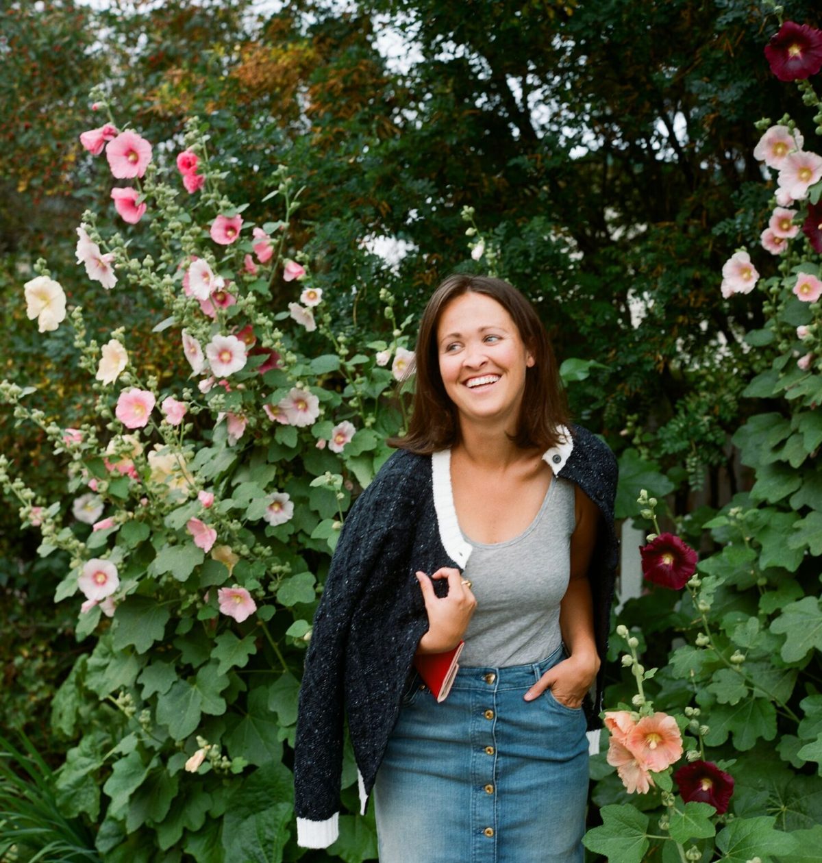 Jackson Hole blogger next to tall flowers shot on film