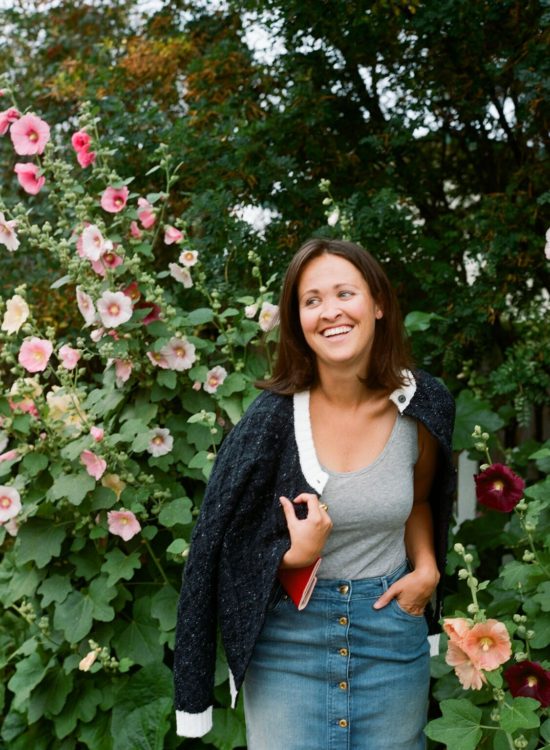 Jackson Hole blogger next to tall flowers shot on film