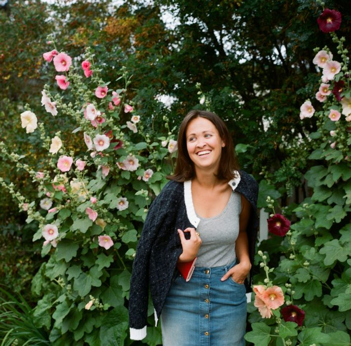 Jackson Hole blogger next to tall flowers shot on film