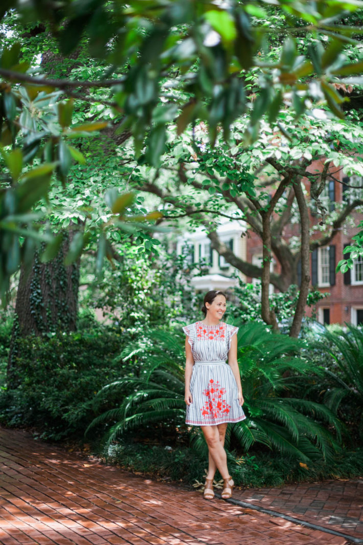 Travel blogger visits Downtown Savannah Georgia wearing Kate Spade dress