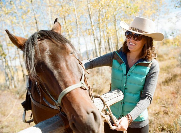 Jackson Hole Blogger Meagan brushes her horse at Turpin Meadow Ranch in Grand Teton National Park