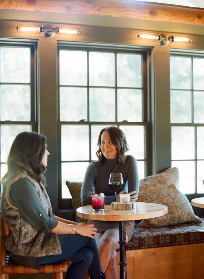 Jackson Hole Blogger drinking wine with friend at Turpin Meadow Ranch in Grand Teton National Park