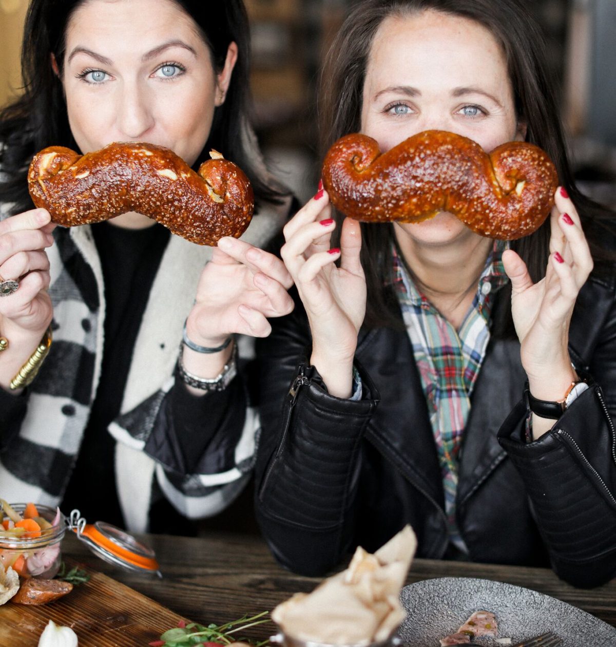 jackson hole blogger digs into mustache pretzel from the handle bar in the four season resort