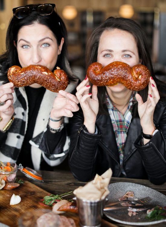 jackson hole blogger digs into mustache pretzel from the handle bar in the four season resort