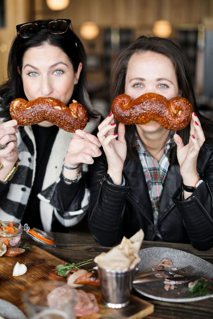 jackson hole blogger digs into mustache pretzel from the handle bar in the four season resort