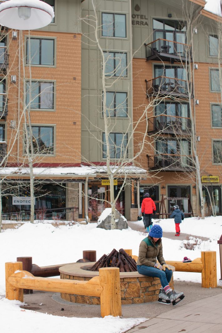 ice skater in front of hotel terra in jackson hole, wyoming