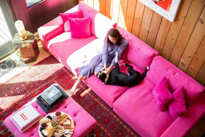 Girl and dog on Pink couch