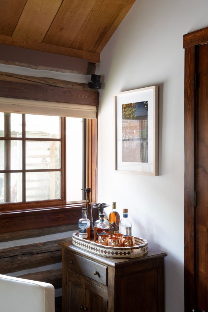 bar cart in chic mountain log cabin