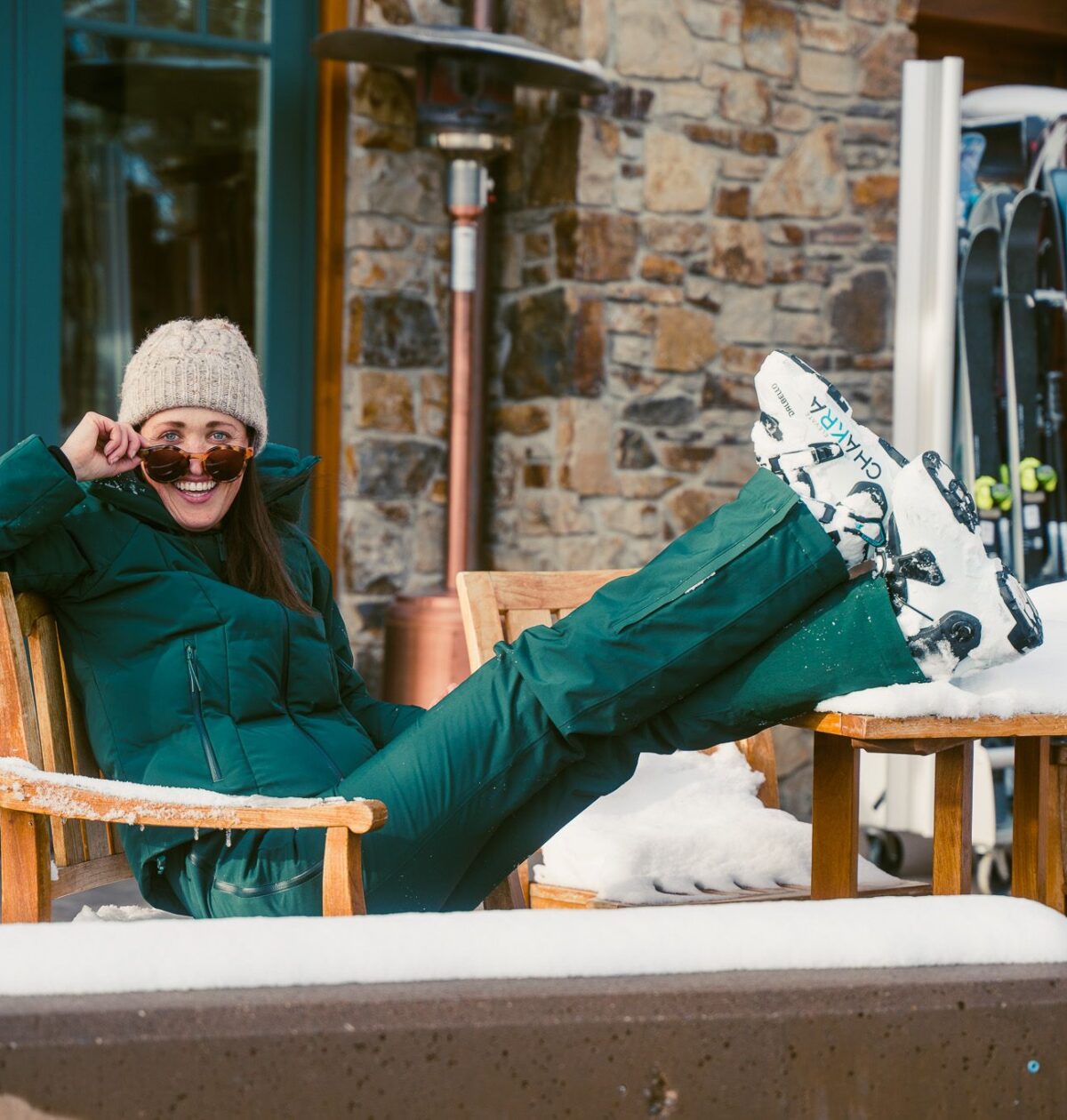 skier girl in halfdays carson bib and georgie puffer in alpine green