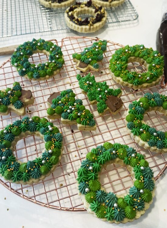 vanilla and pistachio shortbread cookies with buttercream frosting